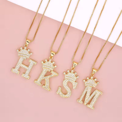 Necklace with English crown letter pendant and white cubic zirconia.