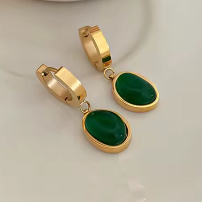 Stainless steel dangle earrings with emeralds